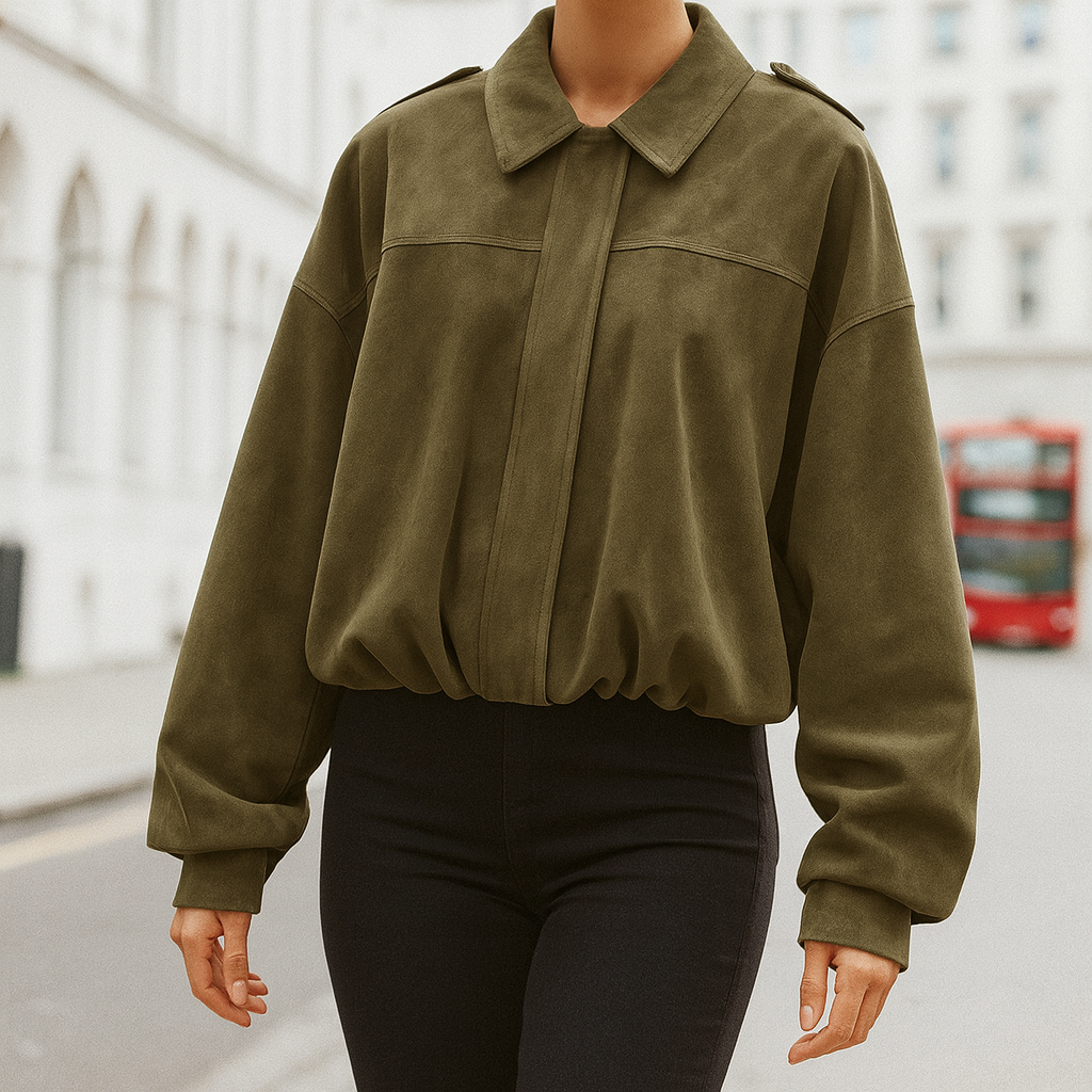 Oversized jacket with a collared neckline, hidden front closure, dropped shoulders, and gathered hem.