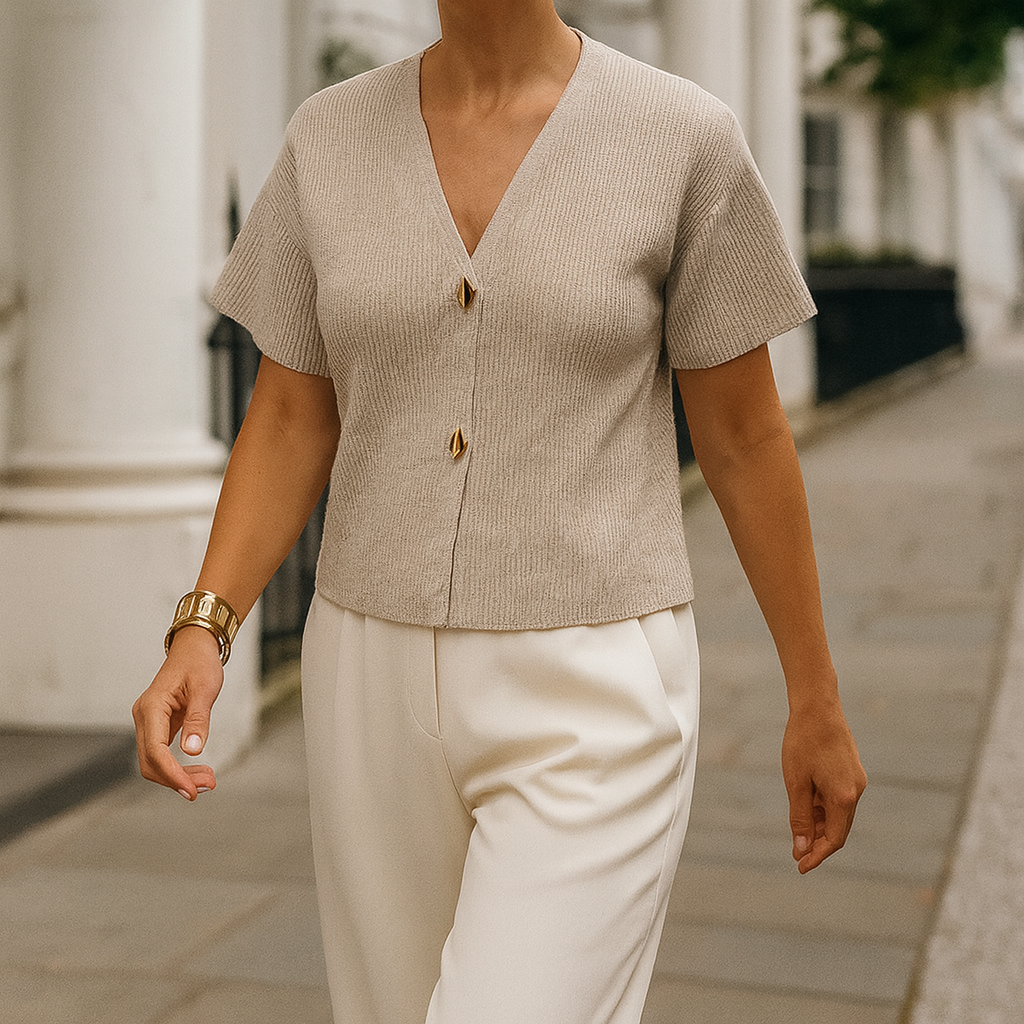 Short-sleeve knit top with a V-neckline and two front decorative buttons.