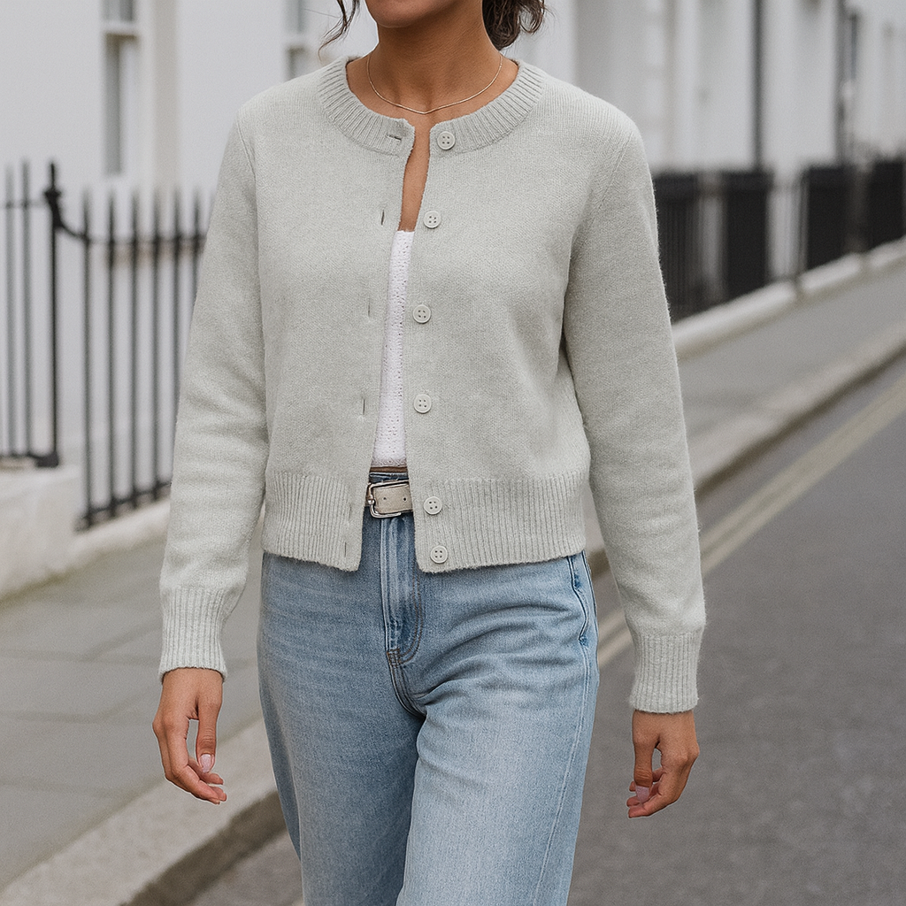 Long-sleeve knit cardigan with a crew neckline, front button closure, and ribbed cuffs and hem.