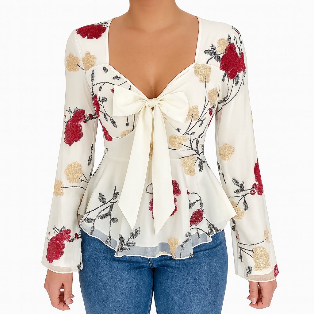 Long-sleeve sheer blouse with a fitted waist, front bow tie, and floral embroidery.