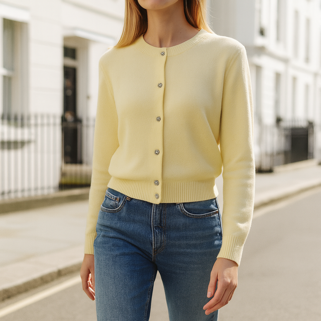 Long-sleeve knitted cardigan with a crew neckline, front button closure, and ribbed cuffs and hem.